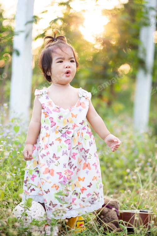 Preview: Cute Girl Smiling Brightly In The Setting Sun