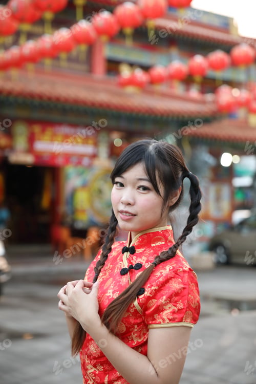 Preview: Beauty Woman Wear Red Cheongsam Looking And Smile In Chinese New Year