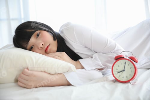 Preview: Portrait Beautiful Asian Girl Sitting With Clock At White Bedroom