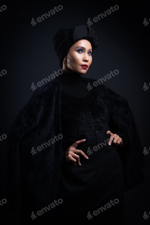 Preview: High Fashion Portrait Of An Asian Woman In A Black Top And Pants With A Turban On Dark Grey