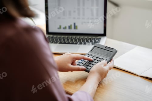 Preview: Female Accountant Calculating A Data Documents.