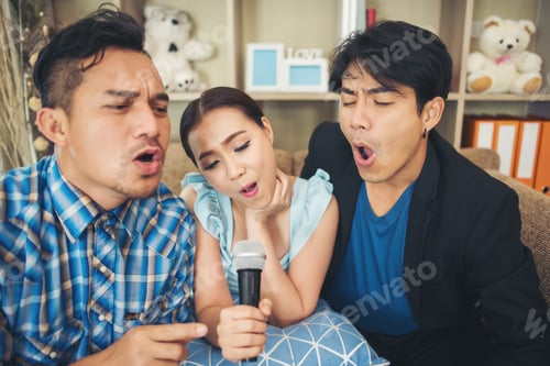 Preview: Group Of Friends Having Fun At Living Room Singing A Song Together