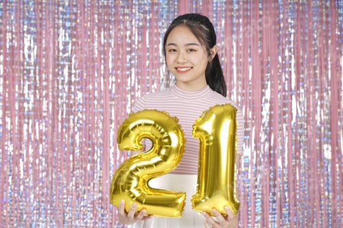 Preview: Asian Young Teenager Pretty Cheerful Beautiful Girl With Party Gold Foil Balloon, On Pink Sparkling