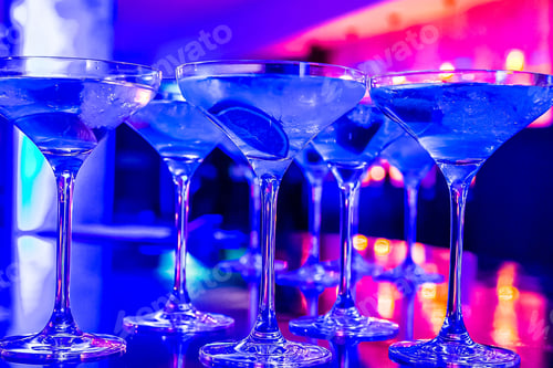 Preview: A Closeup Of Cold Cocktails Under Blue Light In A Club