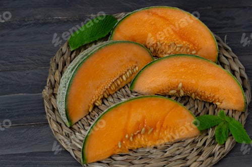 Preview: Cantaloupe Melon On Black Background Dark Food