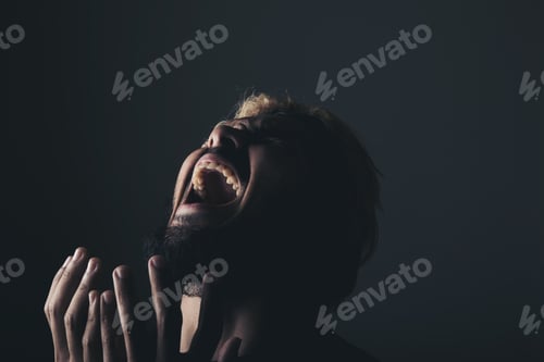 Preview: Handsome Businessman Shouting Like Crazy, Stressed With Work. Studio Portrait Against Black