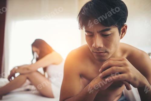 Preview: Depressed Man Sitting On The Bed In Bedroom Have Problem With His Wife