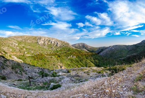 Preview: A Mesmerizing View Of Parnitha Mountain Range Under A Blue Cloudy Sky In Greece