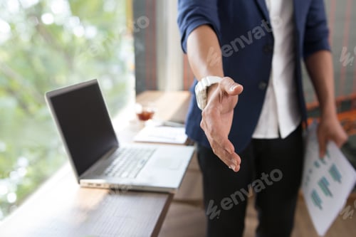 Preview: Asian Businessman Using His Smart Phone, Computer In His Office
