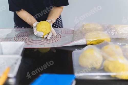 Preview: Woman Hands Preparing Bread Dough On Black Marble Table
