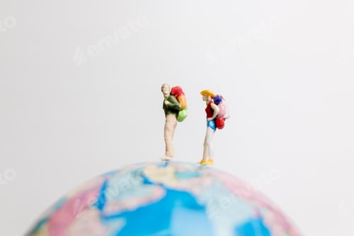 Preview: Miniature People Figure Standing On The Globe World Map With White Background And Copy Space As