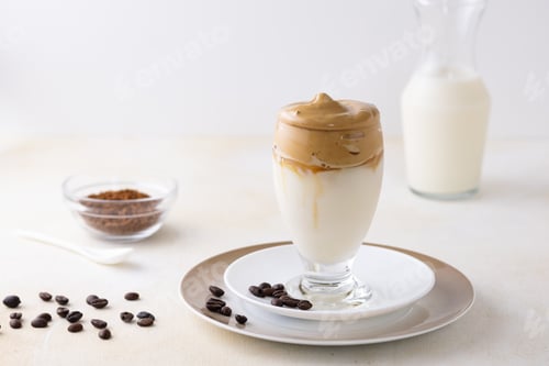 Preview: A Soft Focus Of Dalgona Coffee Topped With Chocolate Chips And A Cinnamon Stick