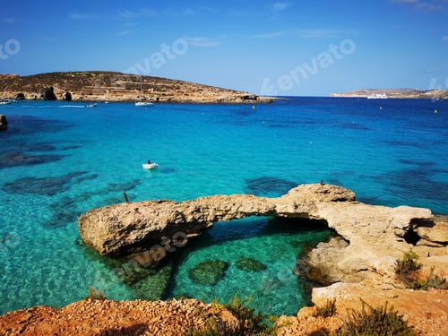Preview: A Landscape Of The Blue Lagoon Surrounded By The Sea Under A Blue Sky In Ghajnsielem, Malta