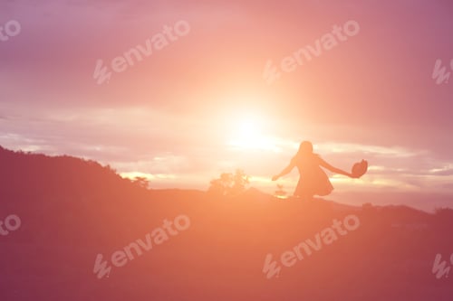 Preview: Silhouette Of Woman Praying Over Beautiful Sky Background
