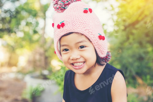Preview: Little Cute Asian Girl Standing Among The Purple Flower Field Sunshine Day. Freedom Enjoying With