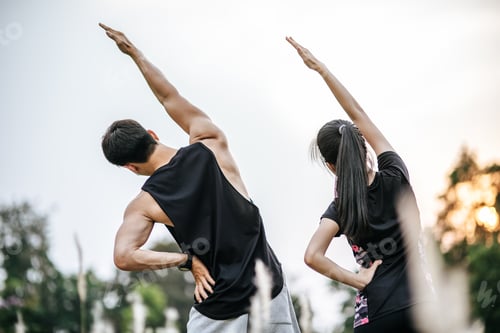 Preview: Men And Women Warm Up Before And After Exercising. Selective Focus.