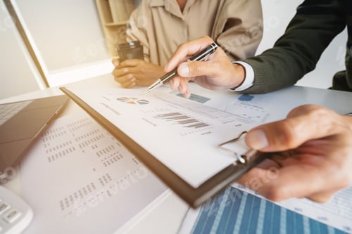 Preview: Financial Auditor Meeting Analyzing A Valuation Of Investment Data.