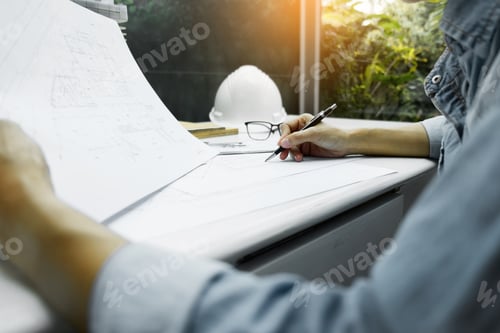 Preview: Person'S Engineer Hand Drawing Plan On Blue Print With Architect Equipment