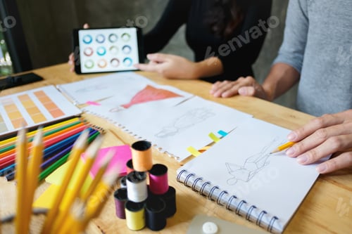 Preview: Close-Up Of Young Creative Fashion Designers Team Working Hard On Project Together