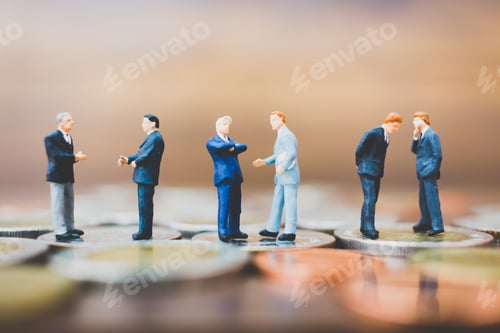 Preview: Miniature People Businessman Standing On Money With Wooden Background