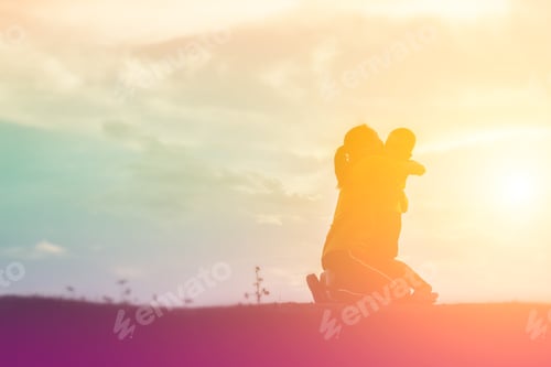 Preview: A Silhouette Of A Happy Young Girl Child The Arms Of His Loving Mother For A Hug, In Front Of The