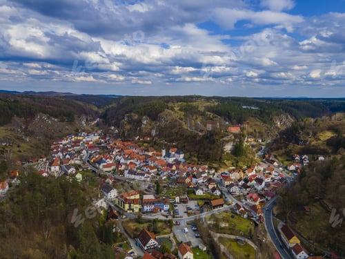 Preview: A Bird'S Eye View Of A Small Mediterranean Town With A Castle On The Hill