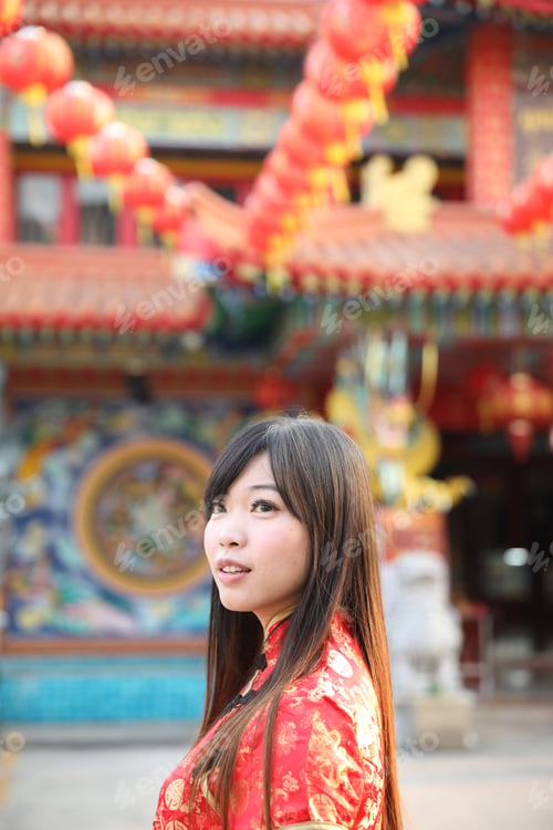 Preview: Beauty Woman Wear Red Cheongsam Looking And Smile In Chinese New Year