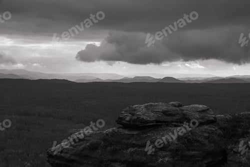 Preview: A Dramatic View Of Huge Rock Formations And Dense Trees In Saxon Switzerland National Park