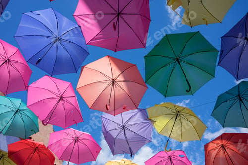 Preview: A Closeup Shot Of Colorful Umbrellas Under A Blue Sky