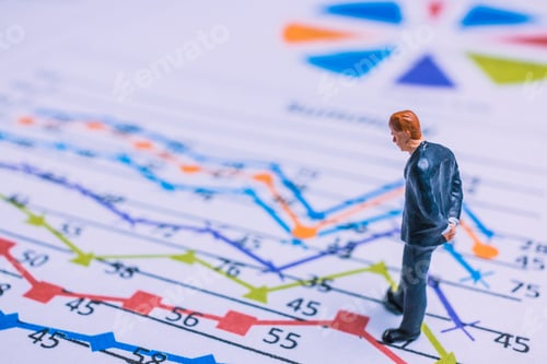 Preview: Miniature People : Businessman Standing On A Paper Graph Chart ,Developing A Teamwork Concept