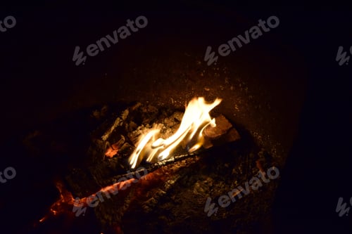 Preview: A High Angle Shot Of A Campfire On The Ground In The Night - Perfect For Wallpapers