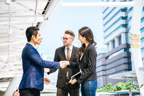 Preview: Business Partner Shaking Hands And Smiling While Meeting In Front Of Office. Business And Success