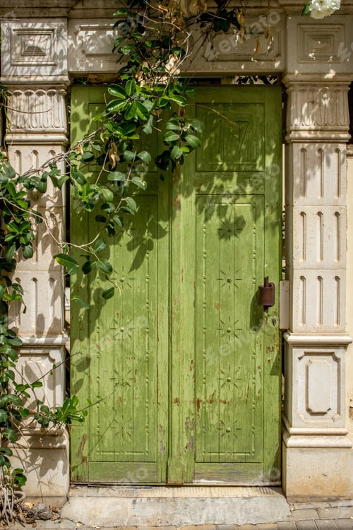 Preview: A Vertical Shot Of A Unique Design Of A Wooden Green Door