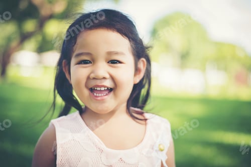 Preview: Portrait Of Little Girl Smiling Showing Happy In The Park