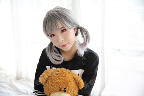 Preview: Asian Young Woman Portrait In Bed Room With Bear Doll On White Tone