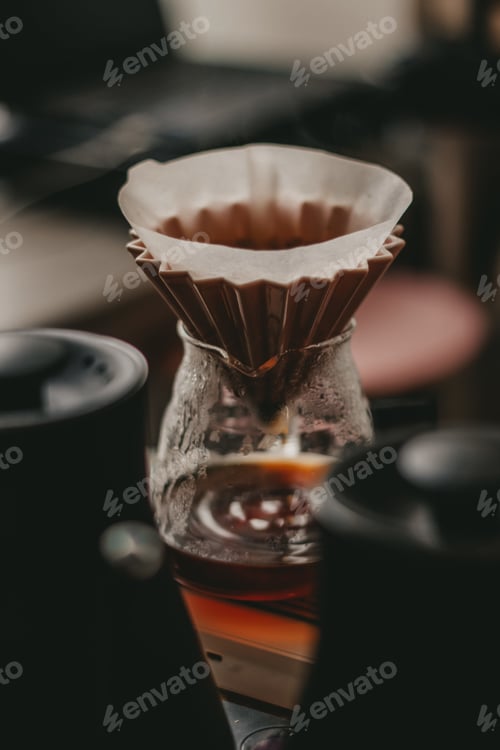 Preview: A Soft Focus Of A Pour Over Coffee Set-Up Using Cone Dripper And Glass Decanter