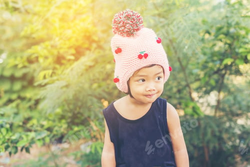 Preview: Little Cute Asian Girl Standing Among The Purple Flower Field Sunshine Day. Freedom Enjoying With
