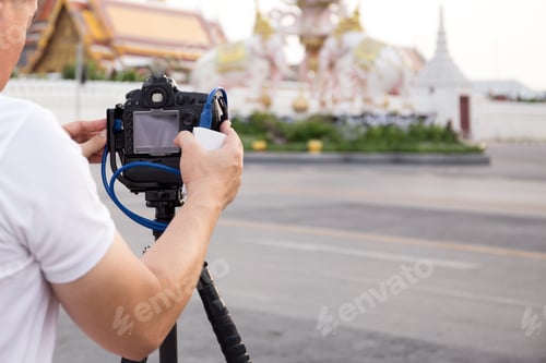 Preview: Traveler Taking Pictures Of Grand Palace In Bangkok With Camera On Tripod