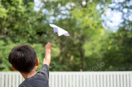 Preview: Little Boy Playing With A Paper Plane In Summer