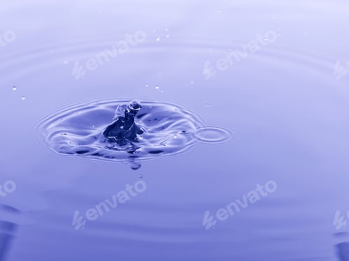 Preview: Close Up Water Droplet Affect The Surface, Forming Rings On The Surface And Making A Perfect