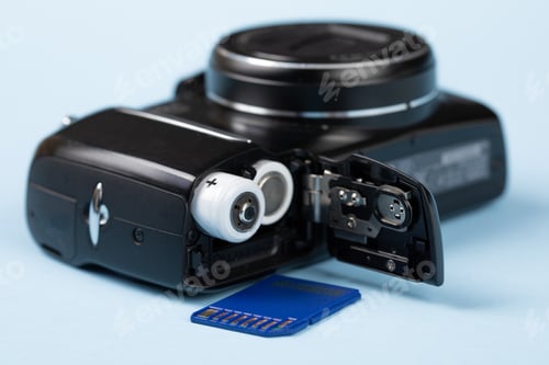 Preview: Closeup Of 2 Double A Batteries In A Point And Shoot Pocket Digital Camera