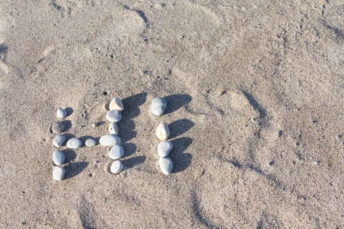 Preview: The Word Hi Written With Stones On The Sand With Space For Text