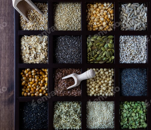Preview: A Top Down View Of A Box Of Individual Compartments Of Seeds And Grains.