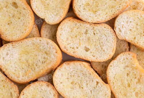 Preview: A Very Close View Of Crostini That Has Been Dabbed With Olive Oil.