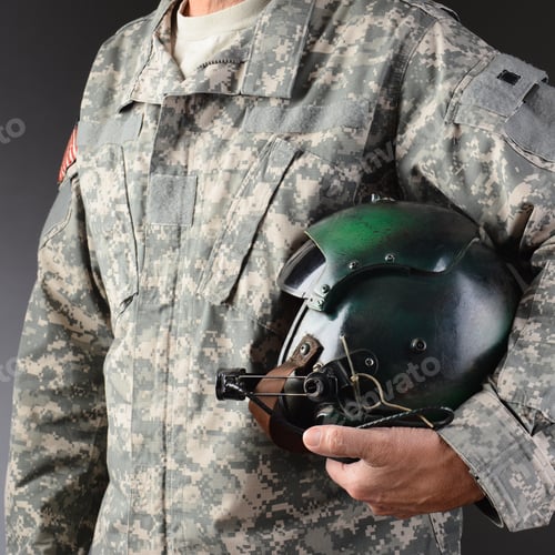 Preview: Closeup Of An American Airman In Camouflage Fatigues Holding A Flight Helmet Under One Arm, Square