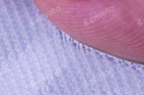 Preview: Finger Stuck And Pulling Away From Surface Of Piece Of Sticky Tape