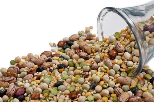 Preview: Assorted Beans Spilled On A Glass Jar Over The White Background