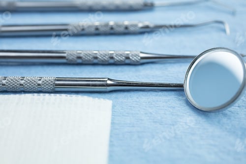 Preview: Dental Picks, Mirror And Gauze On A Paper Lined Tray