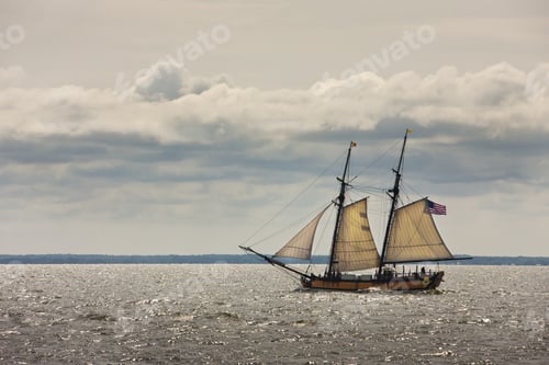 Preview: An Old Sailboat With An American Flag Passes By The Camera.