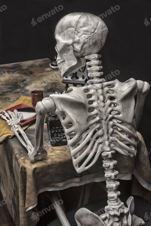 Preview: Human Halloween Skeleton With A Typewriter, Telephone And Cookie On A Plate